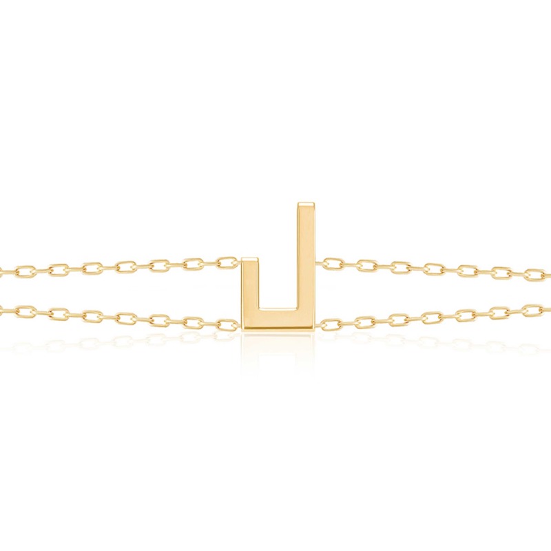 Gold-tone Harfi Laam Bracelet with a central U-shaped motif and two delicate chains on a white background