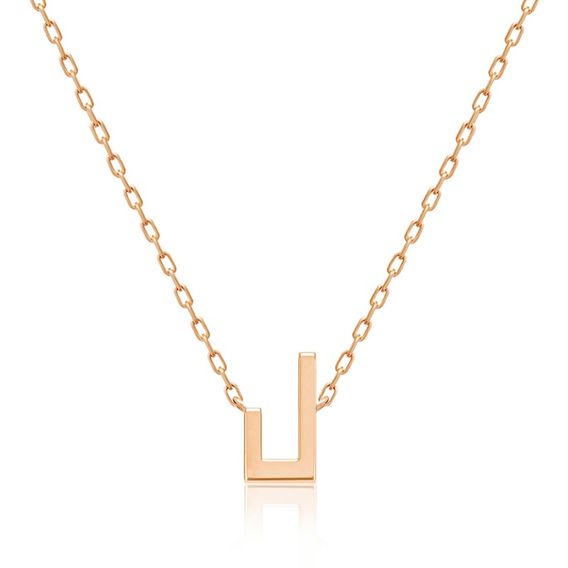 A gold-tone Harfi Laam Necklace with a geometric U-shaped pendant and delicate interlocking chain on a white background
