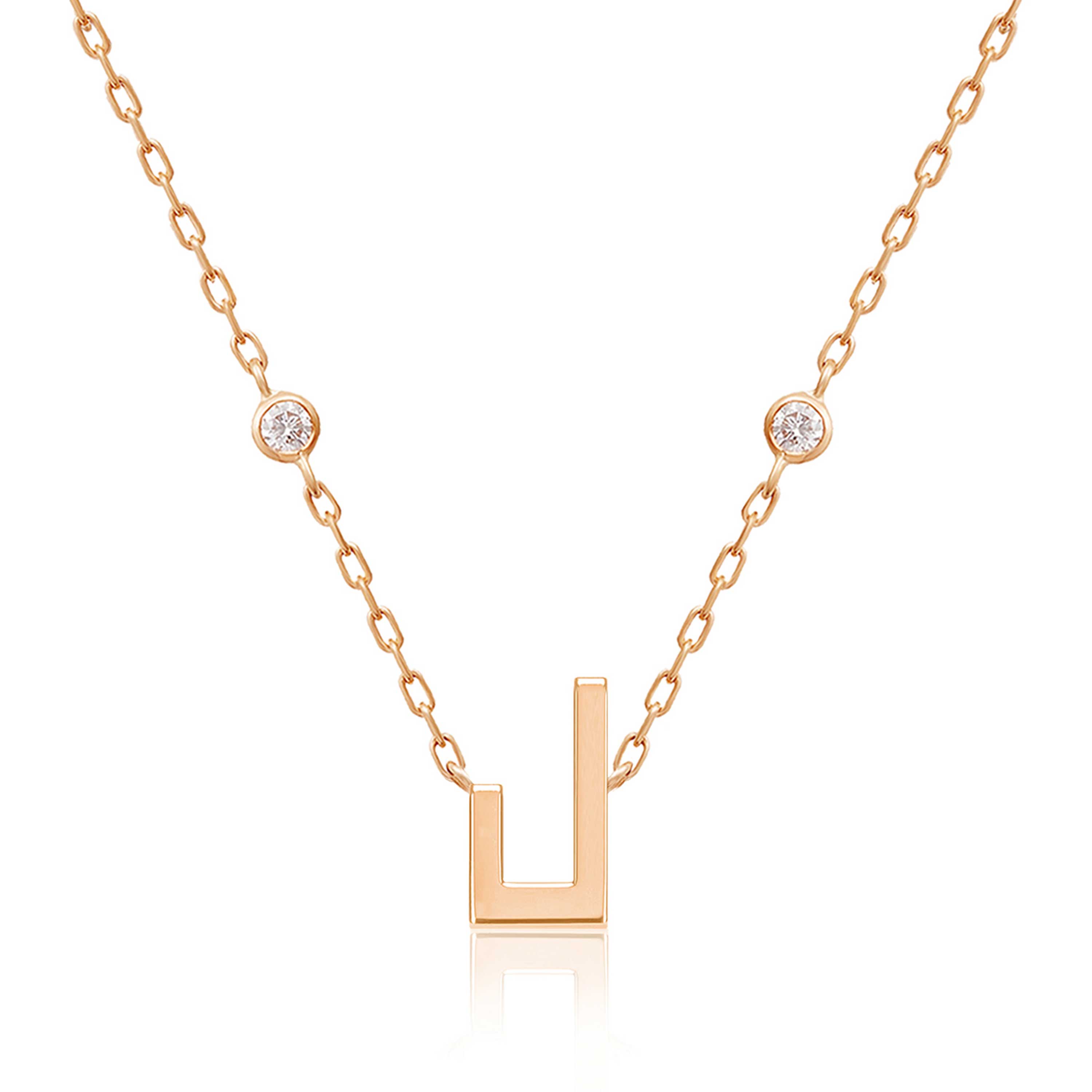 Harfi Laam Necklace with a rose-gold chain, geometric pendant and two round diamond accents on a white background