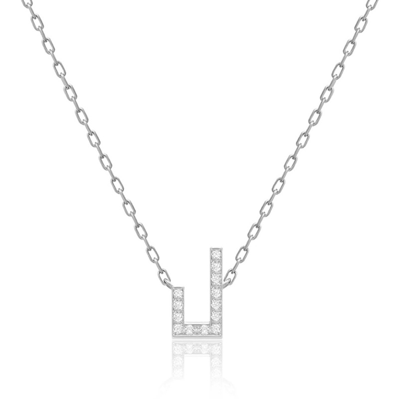 A silver Harfi Laam necklace with a geometric, diamond-set pendant and fine chain displayed against a white background.