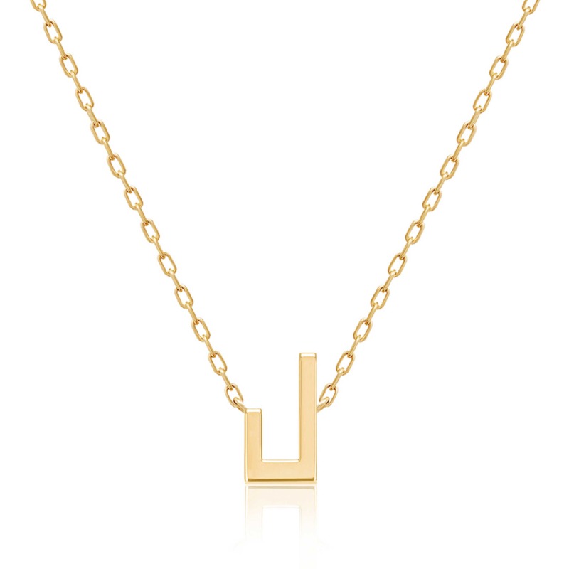Gold-tone Harfi Laam Necklace with a delicate chain and geometric pendant shaped like the Arabic letter lam on white.