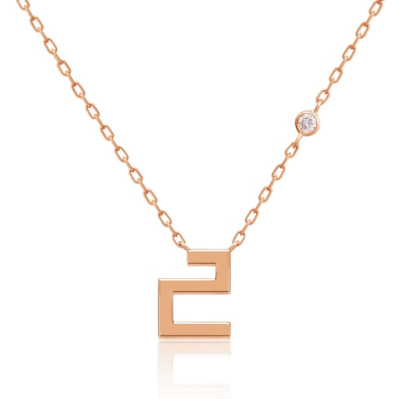 Harfi Ha Necklace by Yataghan Jewellery in rose gold with a round gemstone and a sculpted Ha pendant, linked by a chain.