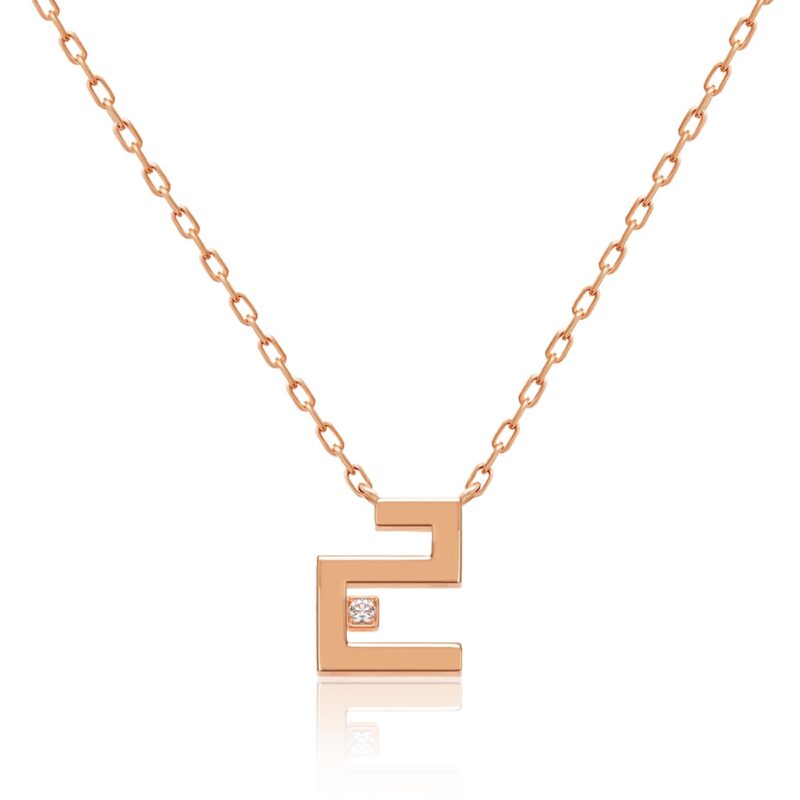 Harfi Jeem Necklace by Yataghan Jewellery with a rose gold chain and a letter Jeem pendant set with a small sparkle.