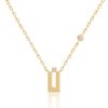 Harfi Noon Necklace from Yataghan Jewellery with a gold chain and geometric pendant, finished with a diamond and small stone accents.
