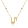 Gold Harfi Ya Necklace with chain links and a square “YA” pendant, set with diamond accents for timeless elegance.