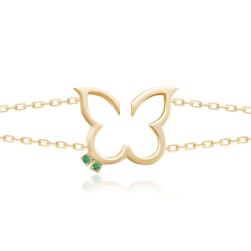 Hurriyah Bracelet in green with a gold-tone chain and bold cutout motif, finished with two emerald-green stones for timeless elegance.