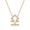 Gold-tone Horoscope Necklace (Libra) with a Libra pendant, round stones, and a soft pink center, on a delicate chain.