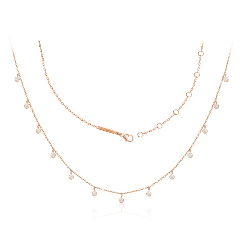 A rose gold Sparkle Round Necklace from Yataghan Jewellery shows layered chains with bezel-set clear stones and a delicate branded clasp.