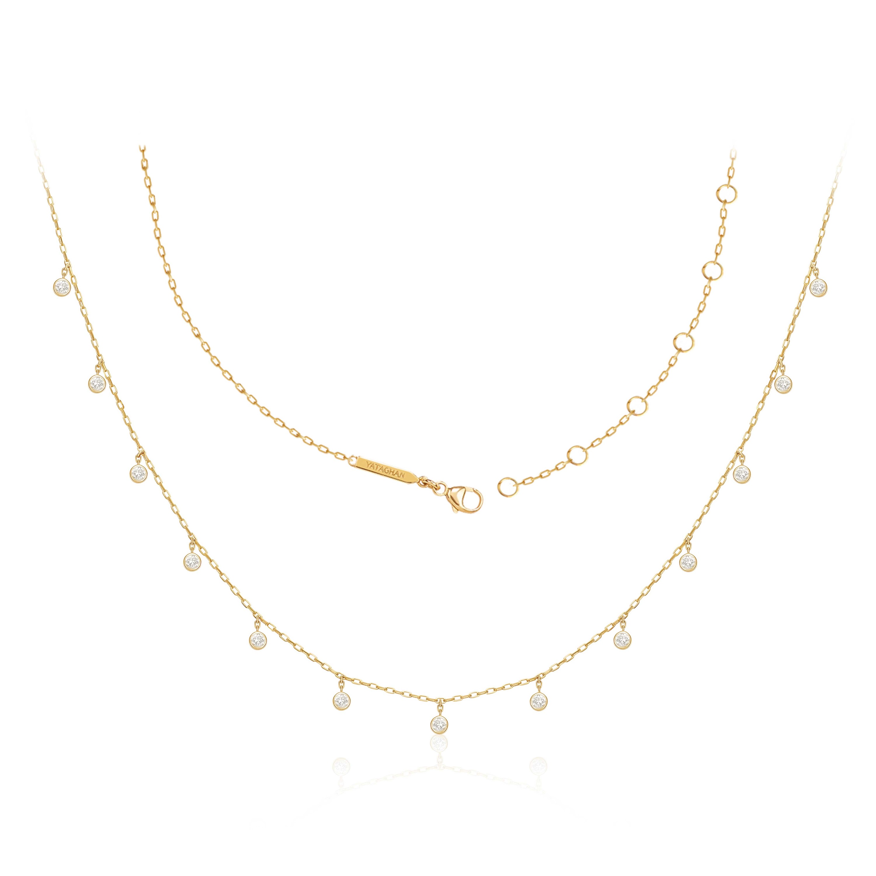 A delicate gold Sparkle Round Necklace from Yataghan Jewellery with dangling round charms and crystal accents, shown against a clean white background.
