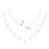 A delicate golden Sparkle Round Necklace from Yataghan Jewellery with tiny round drops and a branded clasp on a white background.