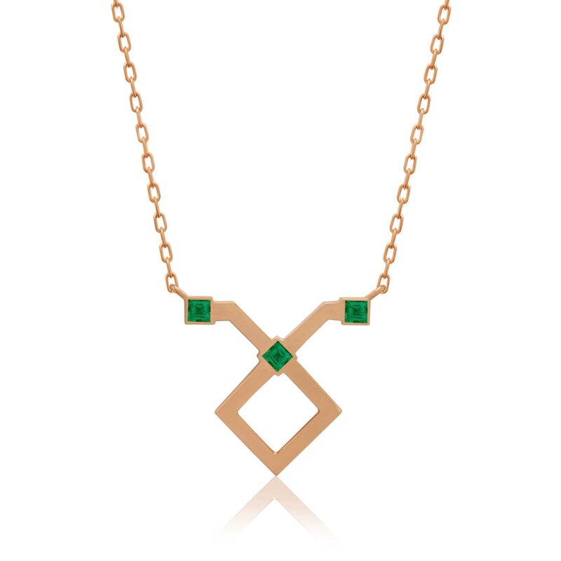 Taurus horoscope necklace with a gold chain and geometric pendant, set with green emerald-like stones from Yataghan Jewellery