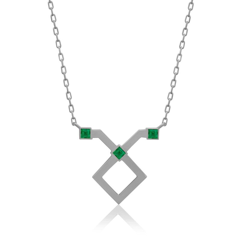 Sterling silver chain necklace with a Taurus horoscope pendant, shaped metal cross with green emerald stones on each side and center.