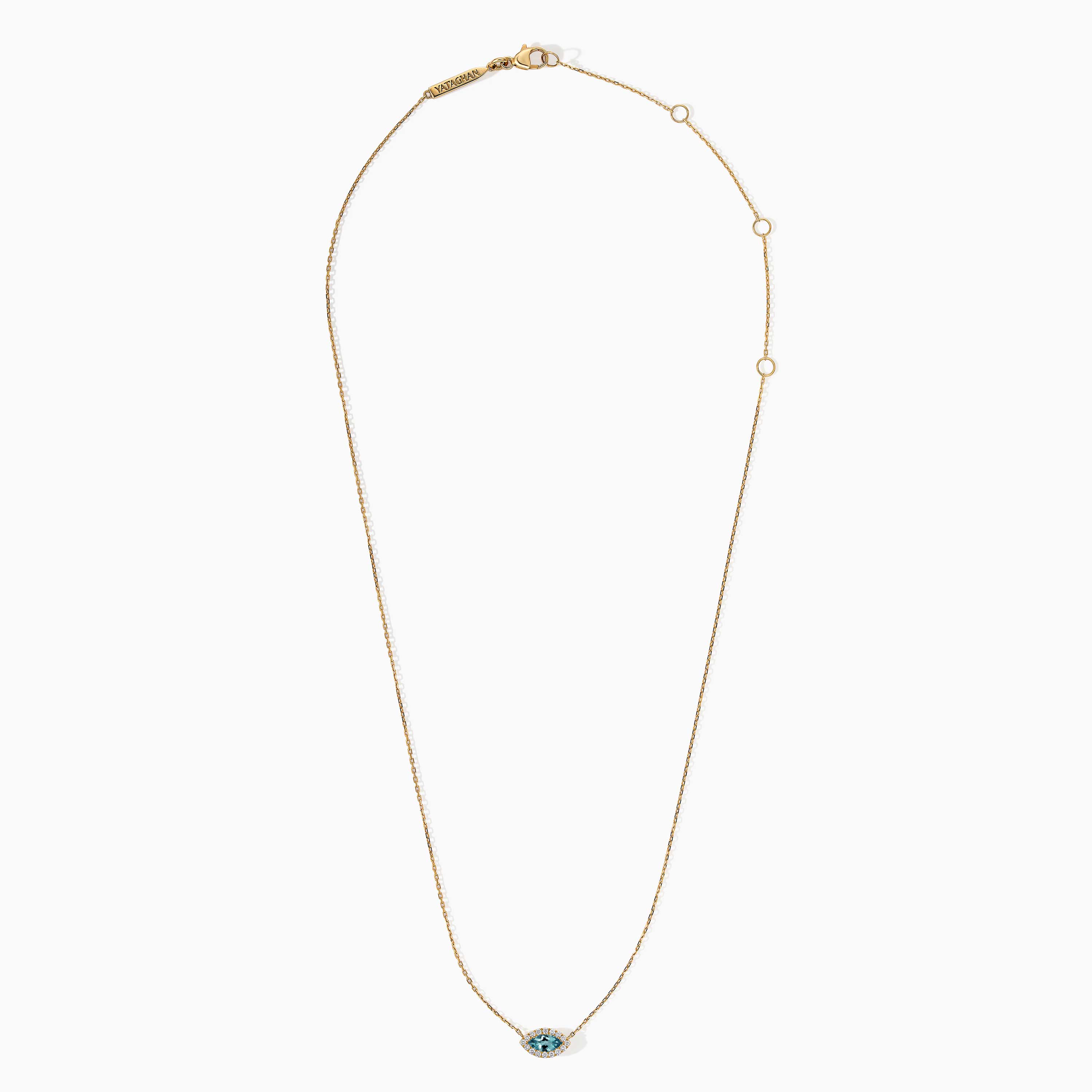 A delicate gold necklace with a marquise blue topaz pendant bordered by small diamonds and a Yataghan clasp detail.