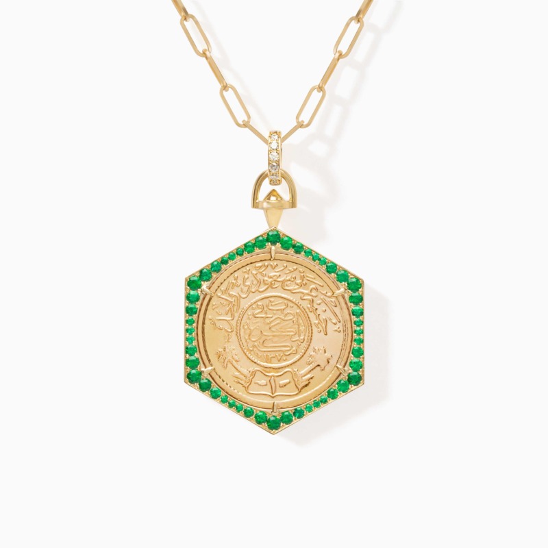Ginea Necklace in Emeralds with a gold bail and clasp set in diamonds, finished with vivid green emerald accents and ornate engraved details.
