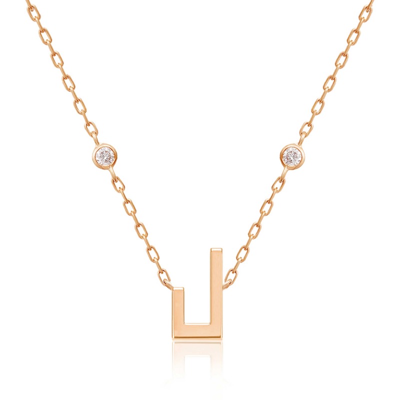 Rose gold Harfi Laam necklace with a geometric pendant, linked chain, and two round diamond accents on a white background.