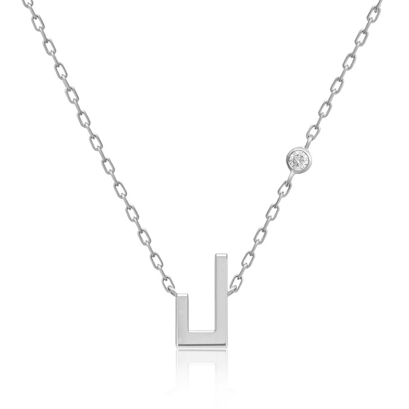 Silver-tone Harfi Laam necklace with a geometric pendant, linked chain, and round sparkling detail from Yataghan Jewellery.