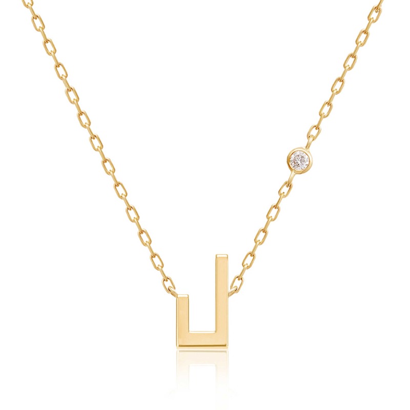 Gold-tone Harfi Laam Necklace with a geometric pendant, oval chain links, and a round diamond accent on a white background.