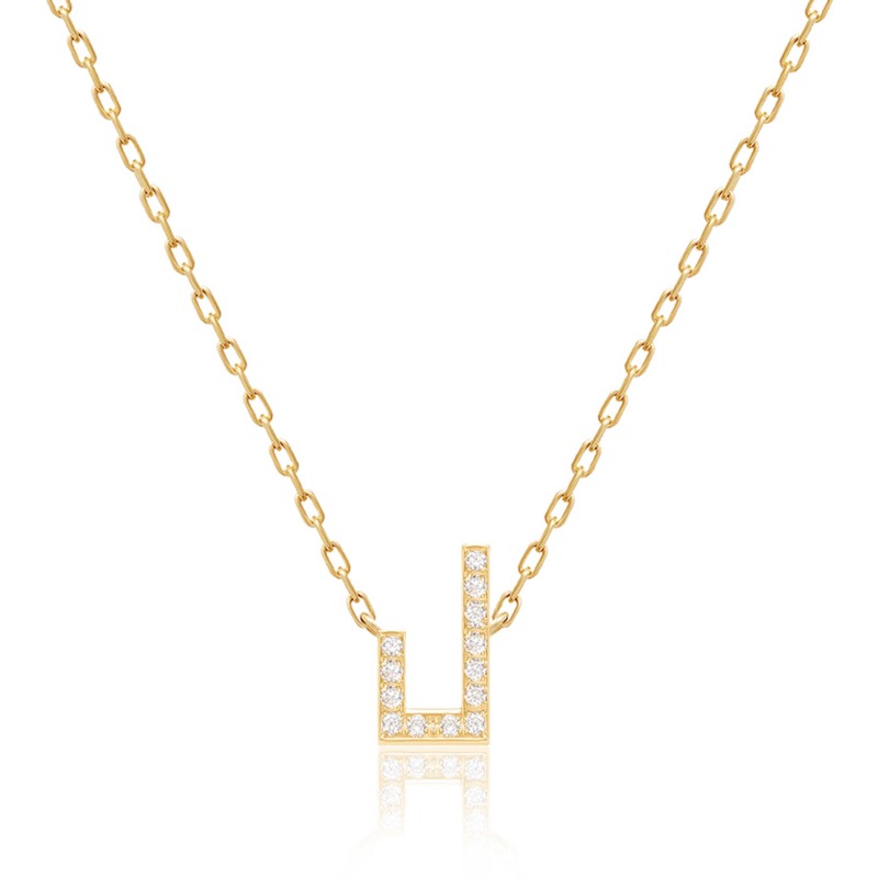 Gold-tone Harfi Laam necklace with a geometric pendant set with sparkling stones on a delicate linked chain
