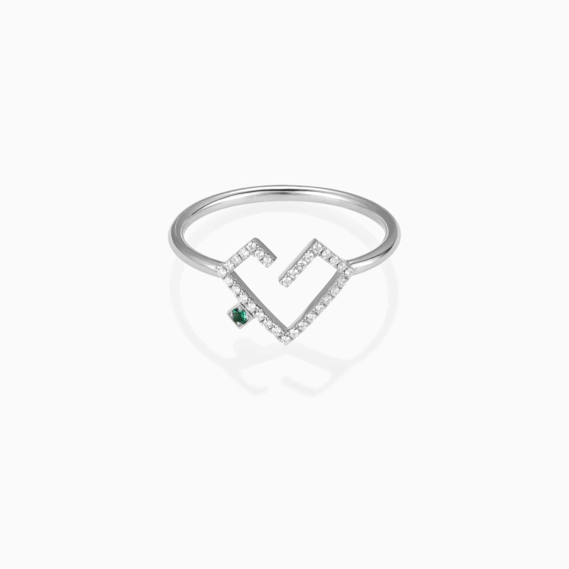 A gold Hubb full diamond ring with a coloured pink dot at the centre and pavé-set sparkle diamonds in a geometric V design.