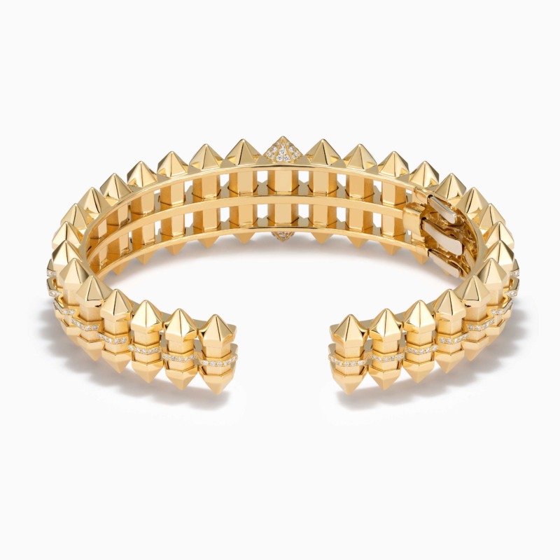 Chakra Graduated Gold Cuff by Yataghan Jewellery with pointed gold studs and diamond-set details in a bold sculptural design.