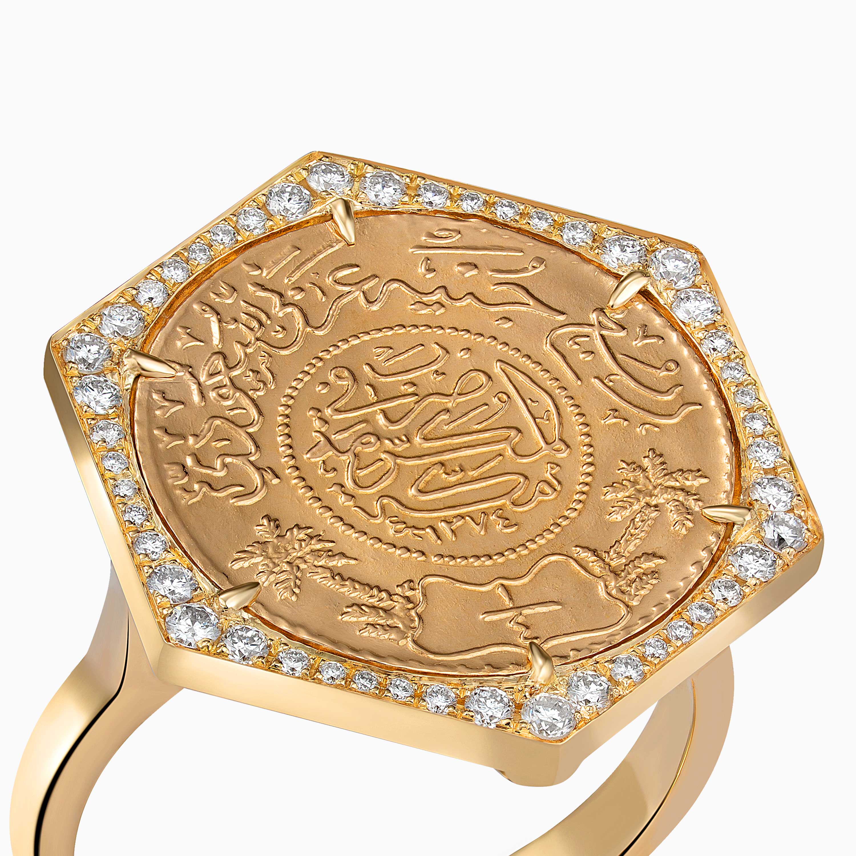 Close-up of Quarter Ginea Ring in Diamond Frame by Yataghan Jewellery in warm gold with engraved motif and round-cut diamonds along the band.