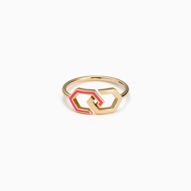 A gold Infinity enamel ring band with pink accents forms a linked geometric design against a clean white background.