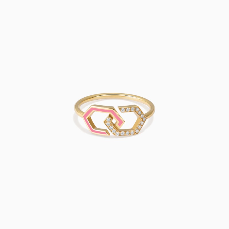 A gold infinity ring band with light pink enamel and diamond details forms a linked geometric design on a clean white background.