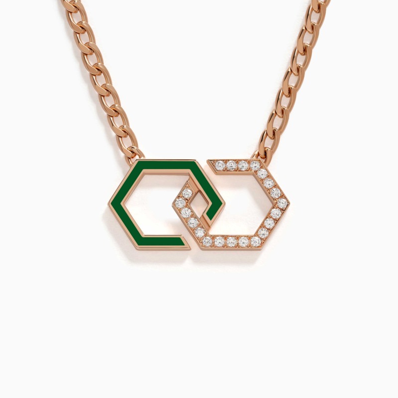 A rose gold necklace with green enamel infinity links and pavé diamonds rests on a white background, creating a bold modern jewellery look.