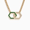 A gold chain necklace with green enamel infinity links and diamond accents rests on a white background, showing the Infinity design by Yataghan Jewellery.