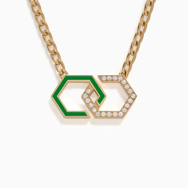 A gold chain necklace with interlocking infinity links, one in light green enamel and the other set with diamonds, rests on a white background.