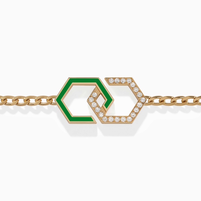 A gold chain bracelet with light green enamel infinity links and diamond pavé accents rests against a clean white background in the center.