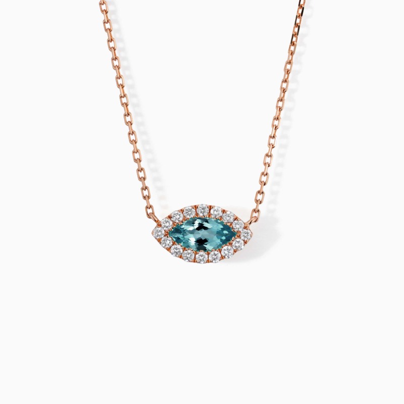 The Eye necklace in rose gold features a marquise blue topaz pendant bordered by diamonds on a delicate chain.