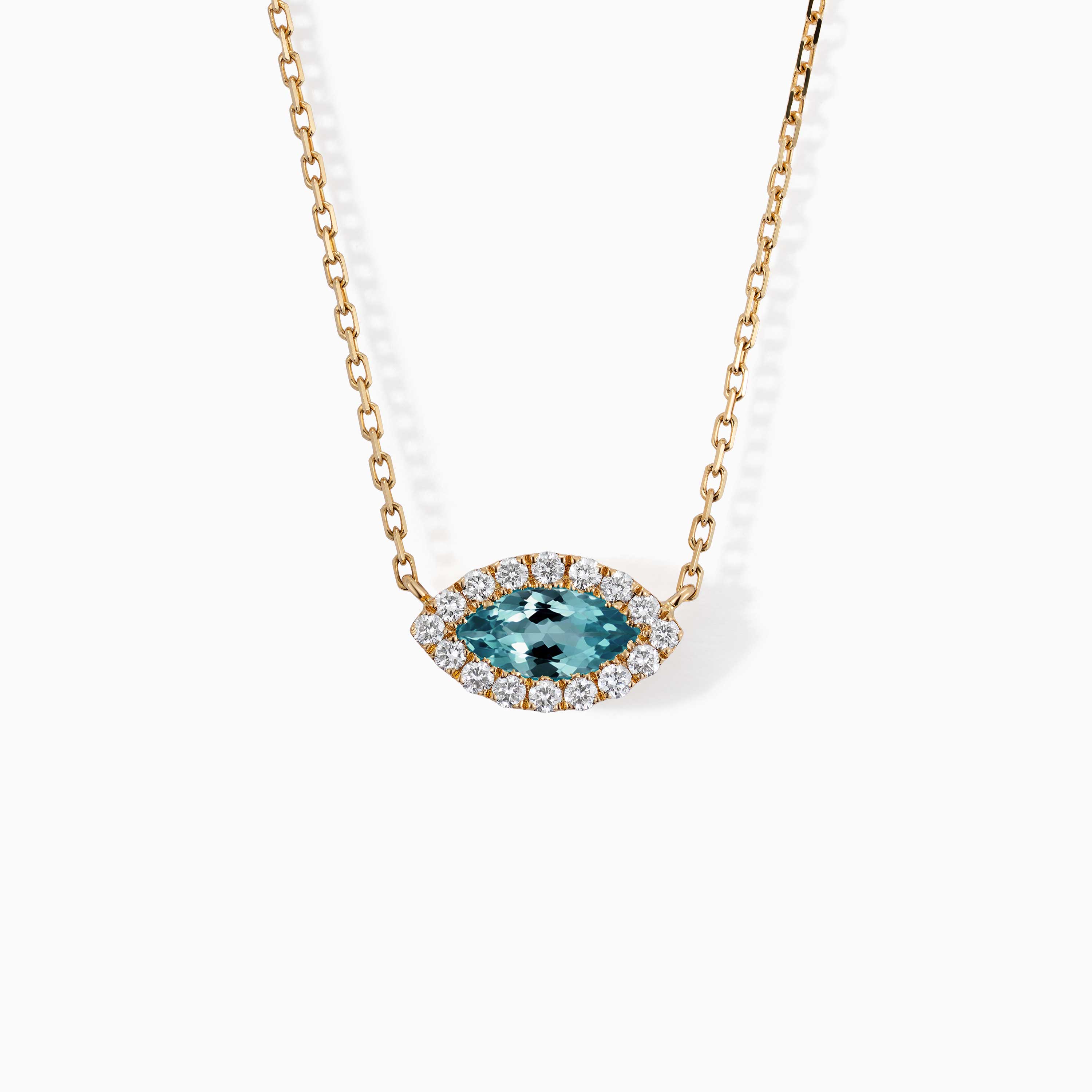 A marquise blue topaz pendant framed by diamonds hangs from a gold chain on a white background.