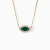 A gold chain necklace with a marquise green emerald center stone surrounded by diamonds on a white background.