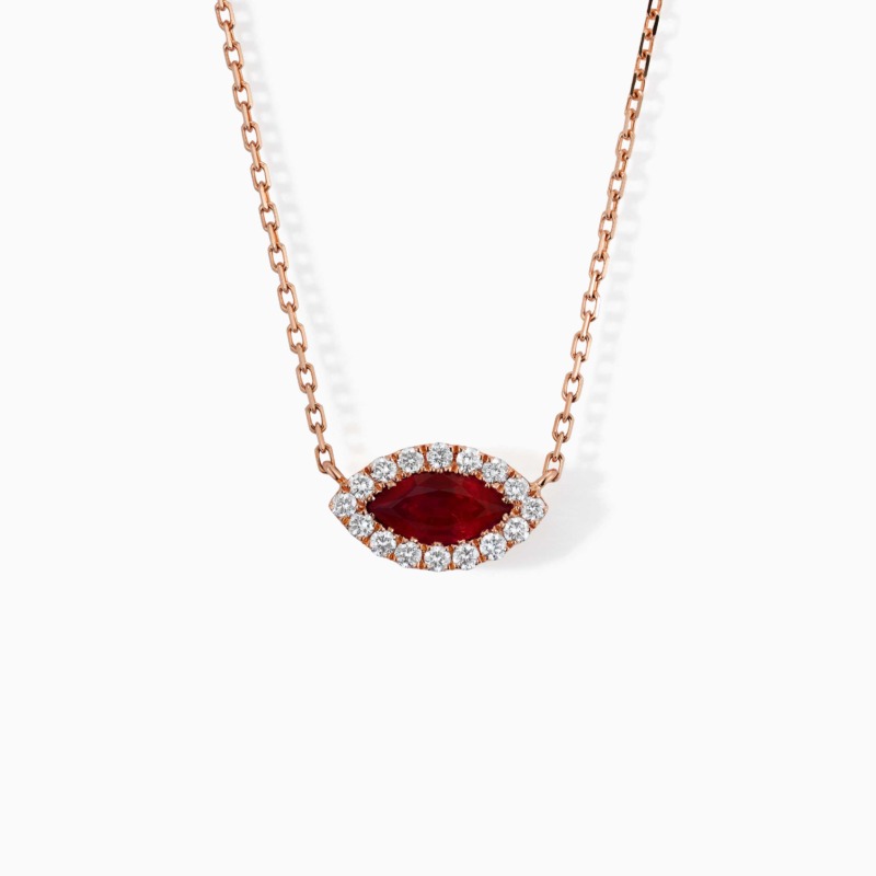 Rose gold necklace with a marquise ruby center stone surrounded by diamonds on a white background.