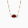 A gold chain necklace from The Eye features a marquise red ruby center framed by sparkling diamonds.